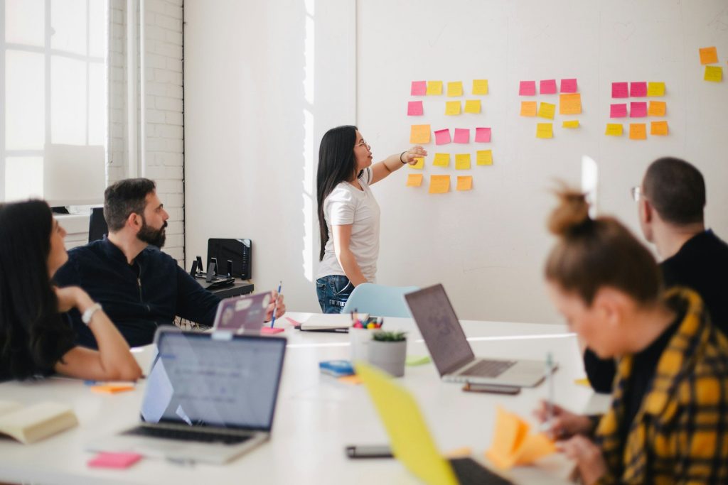 Team mapping strategy with sticky notes on a whiteboard